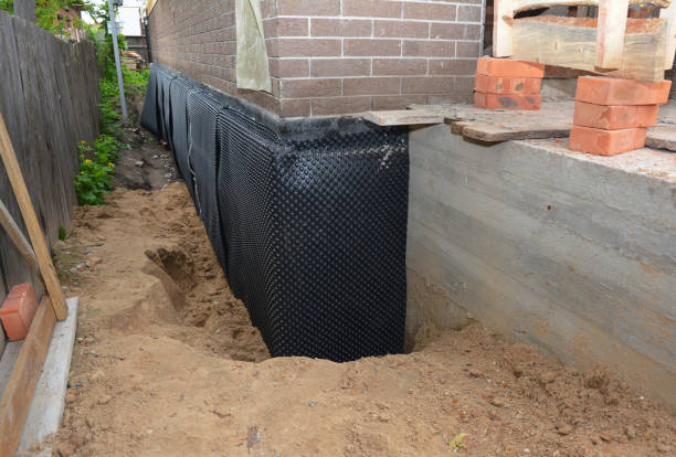 Happy homeowners after waterproofing job in Gwynneville